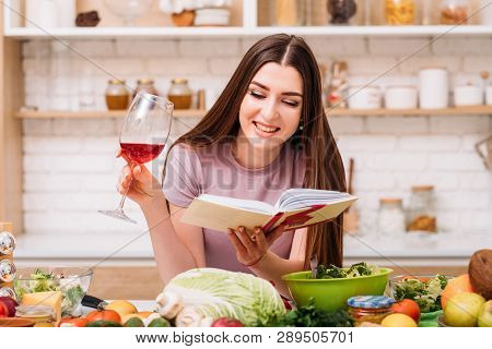 Love Cookery. Balanced Nutrition Blogger. Smiling Young Woman With Red Wine Glass. Book Of Healthy R