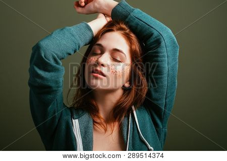 Young Woman Portrait. Enoying Freedom. Redhead Female With Closed Eyes And Raised Arms.