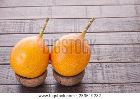 Passion Fruit Granadilla On The Table - Passiflora Ligularis