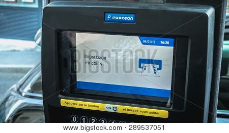 Sete, France - January 4, 2019: Print In Progress Written In French On A Parking Ticket Machine On A