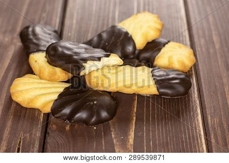 Lot Of Whole One Half Of Lazy Cookie With Chocolate Stack On Brown Wood