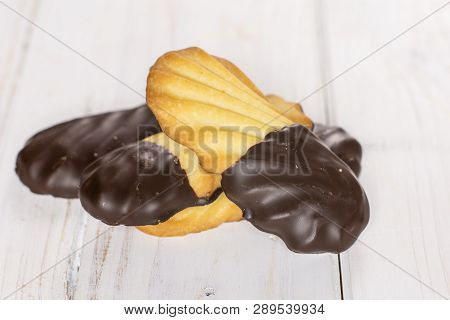 Group Of Four Whole Lazy Cookie With Chocolate On White Wood