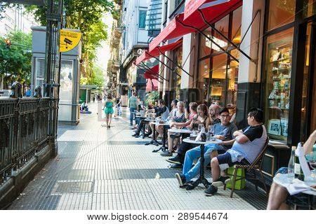 Buenos Aires Argentina - Dec 25, 2018:People on famous cafe at Avenida de Mayo in Buenos Aires city, Argentina