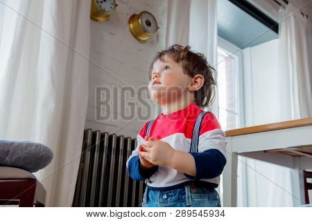 Little Todler Boy Stay At Kitchen In A Day And Watiching Something
