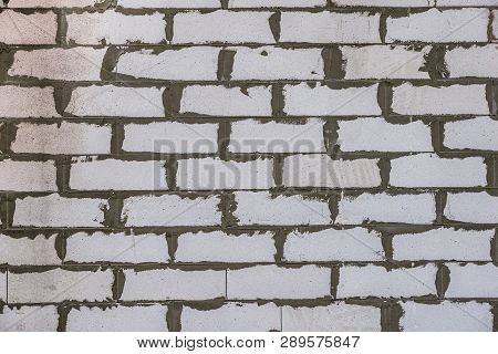Texture Wall Of White Foam Concrete Blocks Laid On A Cement Screed