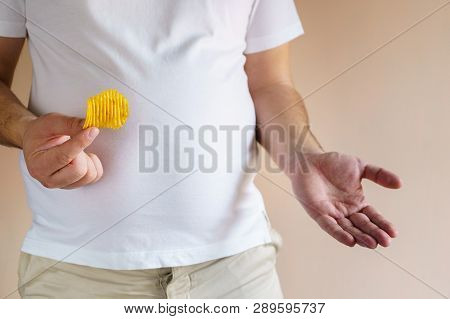 Processed Products, Fast Food, Unhealthy Diet, Imbalanced Ration. Overweight Man Eating Salted Fatte