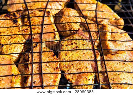 Barbecue With Delicious Meat On The Grill Top View