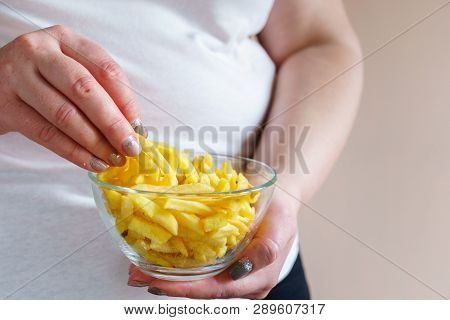 Processed Products, Fast Food, Unhealthy Diet, Imbalanced Ration. Overweight Woman Eating Salted Fat