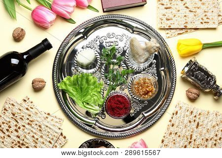 Flat Lay Composition With Symbolic Passover (pesach) Items And Meal On Color Background