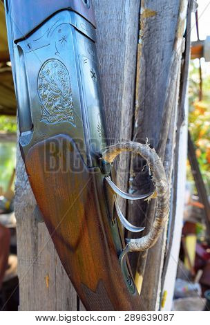 Trigger Cock Of Old Rifle Close Up With Wooden Background