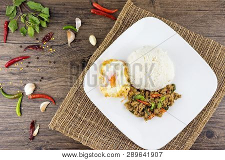 Spicy Thai Basil With Crispy Chicken And Egg (pad Krapow Gai) On Table . It Is A Very Delicious Thai