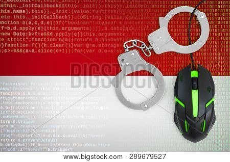 Indonesia Flag  And Handcuffed Computer Mouse. Combating Computer Crime, Hackers And Piracy