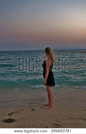 Girl Dreams Looking At The Beautiful Sunset