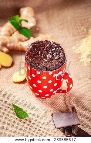 Baked Ginger Chocolate In Red Cup. Close Up