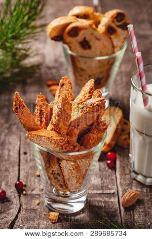 Biscotti Or Cantucci With Milk On Wooden Rustic Table. Close Up. Christmas Or New Year Food Concept