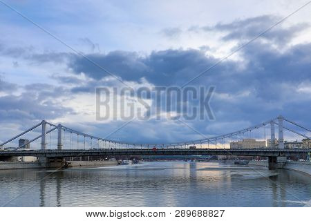 Krymsky Bridge Or Crimean Bridge  Across The Moskva River In Moscow In The Rays Of Setting Sun In Th