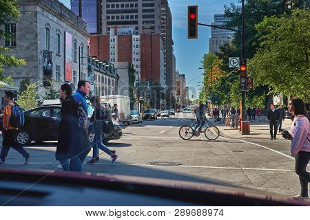 Montreal, Quebec, Canada, September 14, 2018: Pedestrians Are Crossing A Pedestrian Crossing, To A G