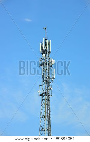 Radio Tower With Antennas On A Blue Sky Background. Metal Construction. Wireless Network. Transmit T