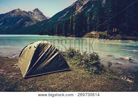Camping Tent In The Nature. Mountains And Lake.