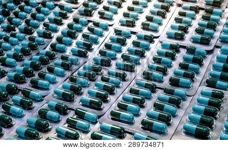 Closeup Green-blue Antibiotic Capsule Pills In Blister Pack. Antimicrobial Drug Resistance. Pharmace