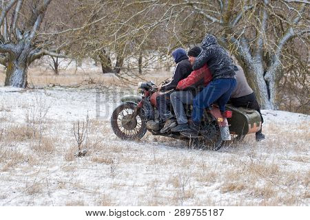 Taraclia, Moldova - 23. 02. 2019: A Team On A Soviet Retro Motorcycle With A Sidecar In The Mud And 