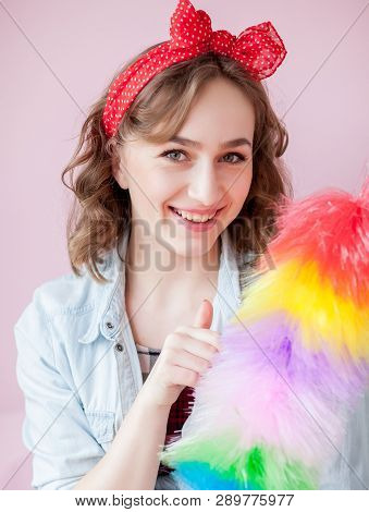 Cleaning Pin Up Woman. Smiling Pinup Girl Holds Colorful Duster Brush. Cleaning Service. Pin-up Girl
