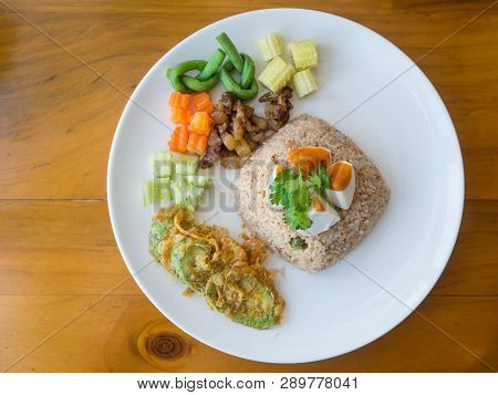 Top View Thailand Food, Kaw Cook Kapee Or Mixed Rice With Shrimp Paste And Eat With Fresh Vegetables