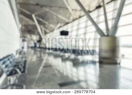 Modern Airport Terminal As Creative Abstract Blur Background. Waiting Room In Airport With Panoramic