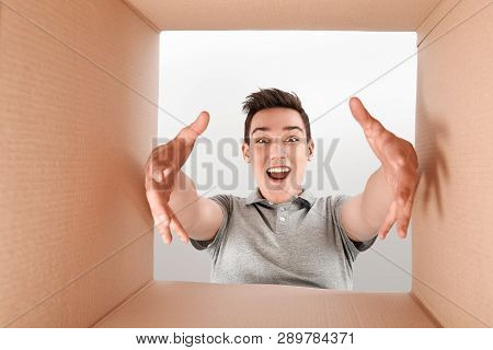 Satisfaction Is A Rating. Surprised Boy Opening Box And Looking Inside. The Package, Delivery, Surpr