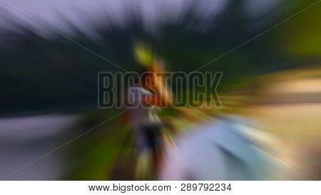Blurred Image A Young Woman Is Standing By The Road.