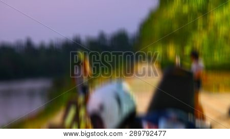 Blurred Images Two Young Women Are Standing Teasing On The Side Of The Road In The Park.