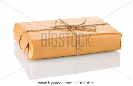 Parcel wrapped in brown paper tied with twine isolated on white