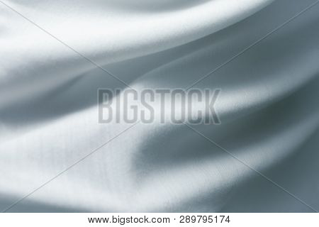 Wavy White Fabric. The Texture Is Crumpled. Blue Material. Satin Texture. Abstraction White Waves. T