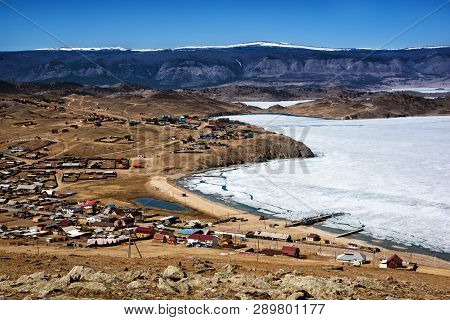 View Of Spring Landscape In Siberia With Part Of Frozen Lake Baikal In The Distance From The Top Vie