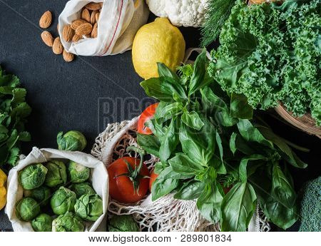 Healthy Vegetarian Ingredients For Cooking. Various Clean Vegetables, Herbs, Nut On Black Background