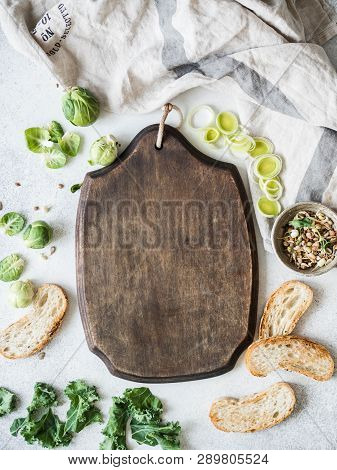 Raw Vegetarian Ingredients For Cooking, Germinated Seeds And Bread Slices On Table And Blackboard In
