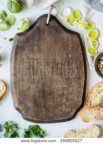 Raw Vegetarian Ingredients For Cooking, Germinated Seeds And Bread Slices On Table And Blackboard In