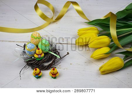 Easter Eggs. Happy Easter Card. Multi-colored Easter Eggs. Easter. Easter Eggs On A White Wooden Bac
