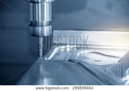 The  Cnc Milling Machine Cutting The Mould Part With The Solid Ball End Mill Tool.the Hi-technology 