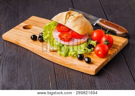 Panini Sandwiches With Fresh Tomatoes And Mozzarella And Prosciutto Ham, Italian Cuisine