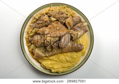 Plate With Pork Meat And Savoy Cabbage And Polenta
