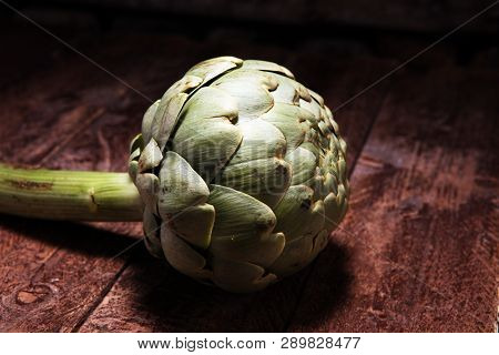 Artichokes On Rustic Background. Fresh Organic Artichoke Flower Set