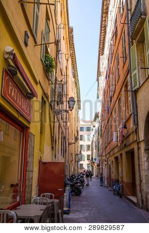 Nice, France - April 18 2017. Colorful Bright Narrow Street With Restaurant In Nice, France.