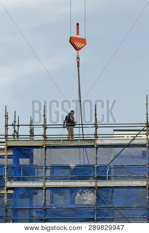 Gosford, New South Wales, Australia - January 31, 2019:  A Working Tower Crane Operation On New Home