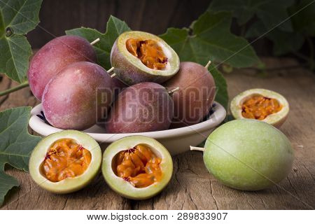 Fruits Of Gulupa On Vine Wood Table, Passiflora Pinnatistipula