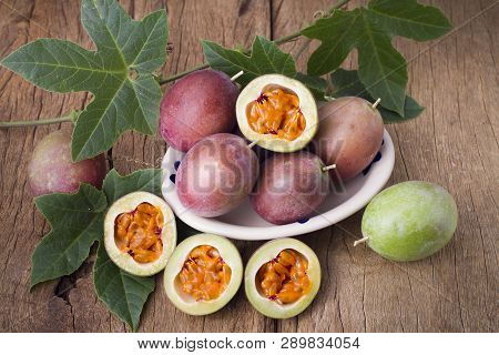 Fruits Of Gulupa On Vine Wood Table, Passiflora Pinnatistipula