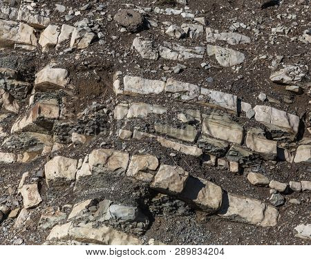 Shale Mountains Cement Pits. The Texture Of The Stone Wall. Large Stone Cracks, The Separation Of Th