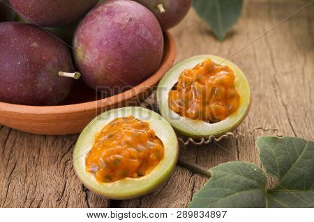 Fruits Of Gulupa On Vine Wood Table, Passiflora Pinnatistipula