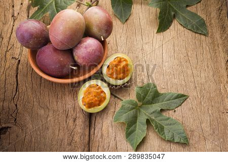 Fruits Of Gulupa On Vine Wood Table, Passiflora Pinnatistipula