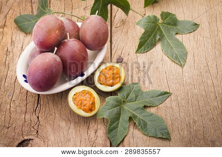 Fruits Of Gulupa On Vine Wood Table, Passiflora Pinnatistipula